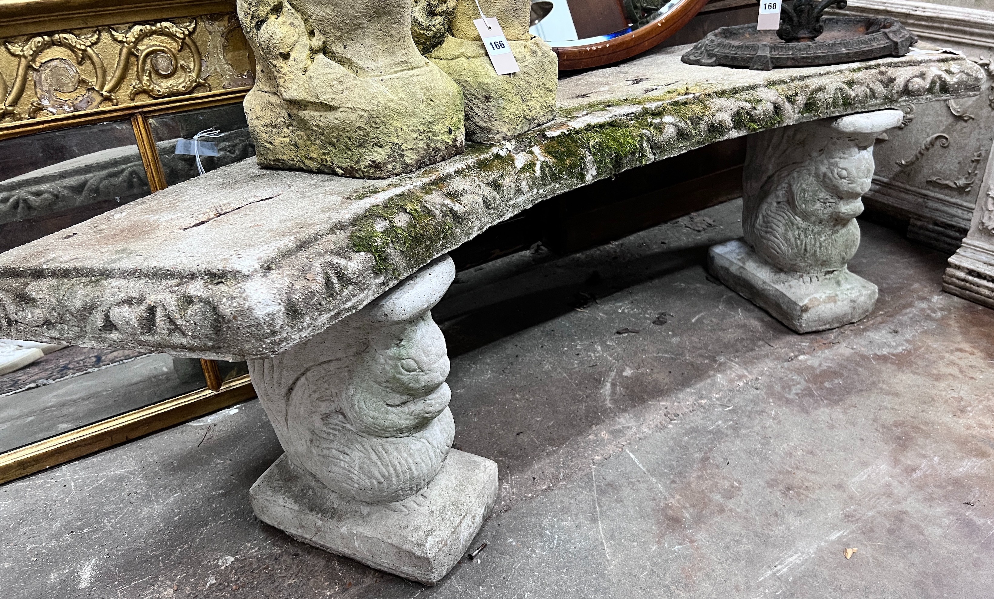 A reconstituted stone curved garden bench, width 160cm, height 46cm *Please note the sale commences at 9am.